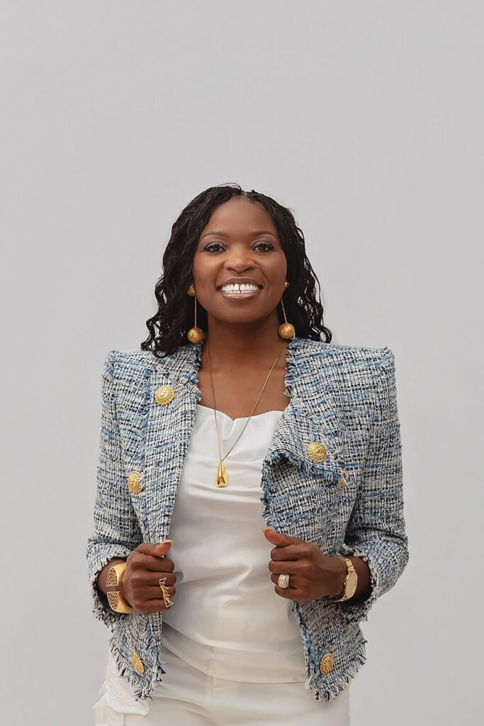 pastor calista on a white studio background with a gray suit